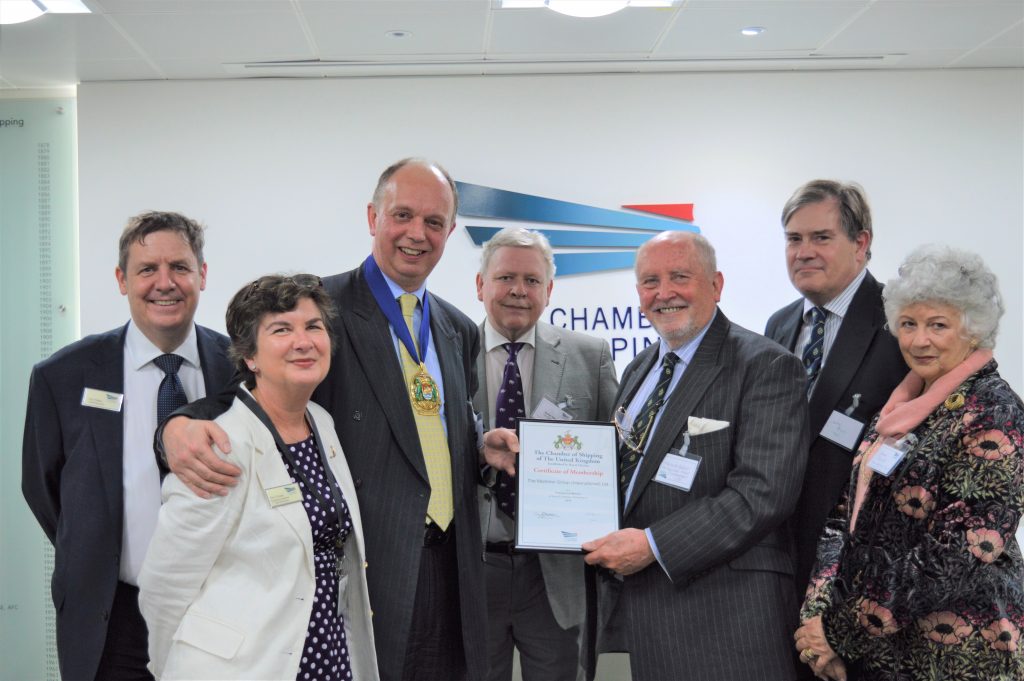 The second shows, from left to right, Guy Platten (CEO of UK Chamber of Shipping), Terry Cooper (Executive Assistant to the CEO of UK Chamber of Shipping). Sir Ian Bibby, Bt (Chairman, UK Chamber of Shipping and MD Bibby Line Group), Kevin Hawes (Business Development Director, The Maritime Group (International) Limited), Captain Malcolm Parrott (MD The Maritime Group (International) Limited), Commander Jonathan Powis (Operations Director, The Maritime Group (International) Limited), Joanna Parrott (Director, The Maritime Group (International) Limited).